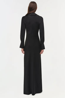 Black satin gown with collared neckline and long flared sleeves, shown from back view on model.