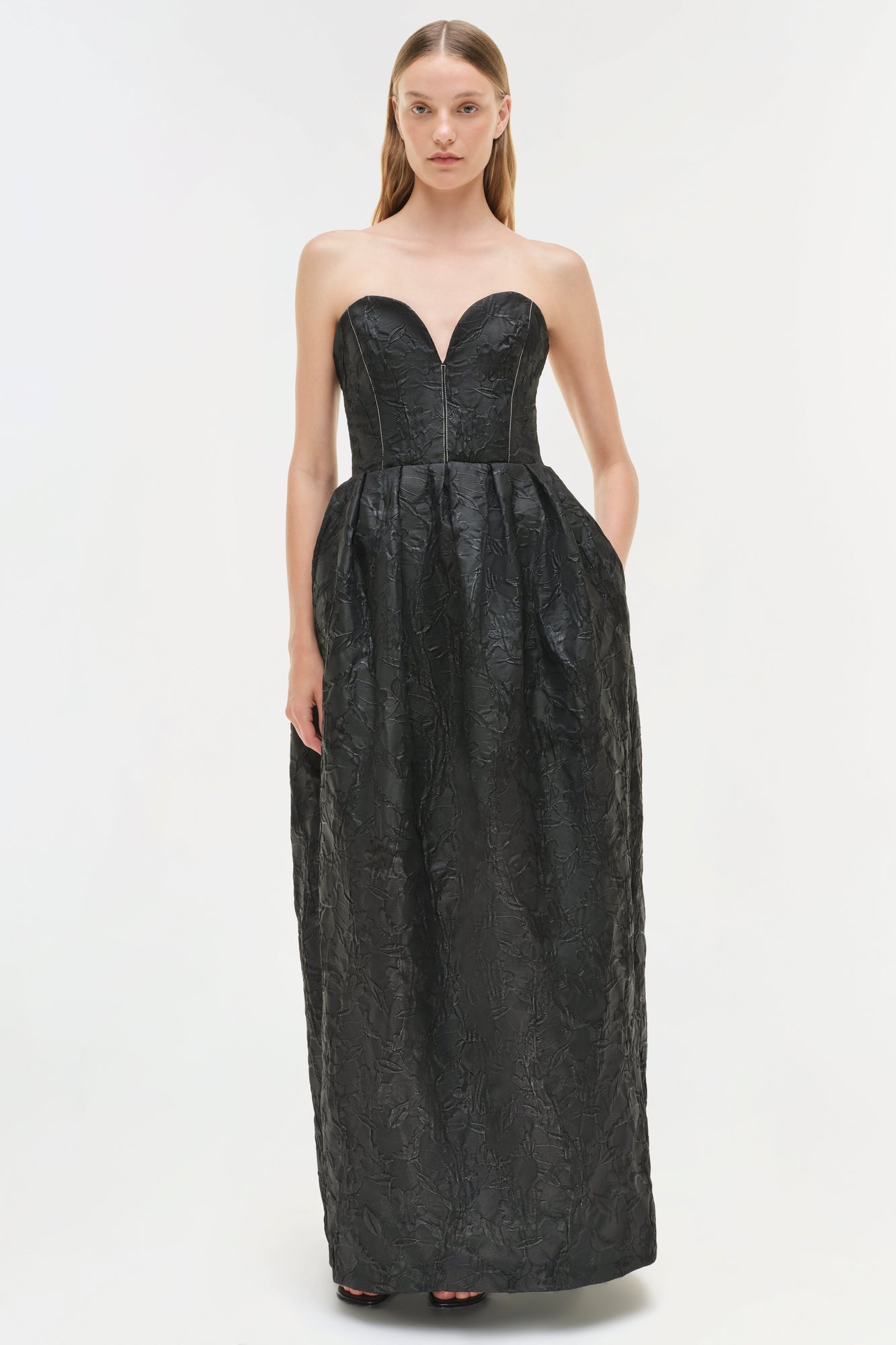 Black jacquard strapless bustier gown with sweetheart neckline and full-length skirt.