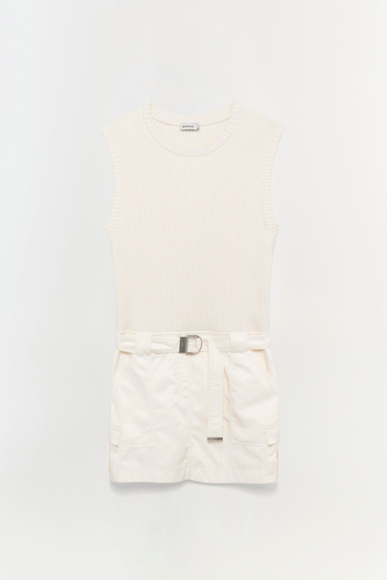 Cream ribbed sleeveless top with white cargo shorts and adjustable belt.