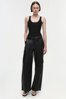 Black leather cargo pants with multiple patch pockets and wide-leg silhouette.