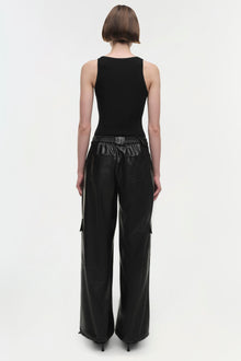 Black leather cargo pants with elasticated waistband and side pockets, worn with black sleeveless top.