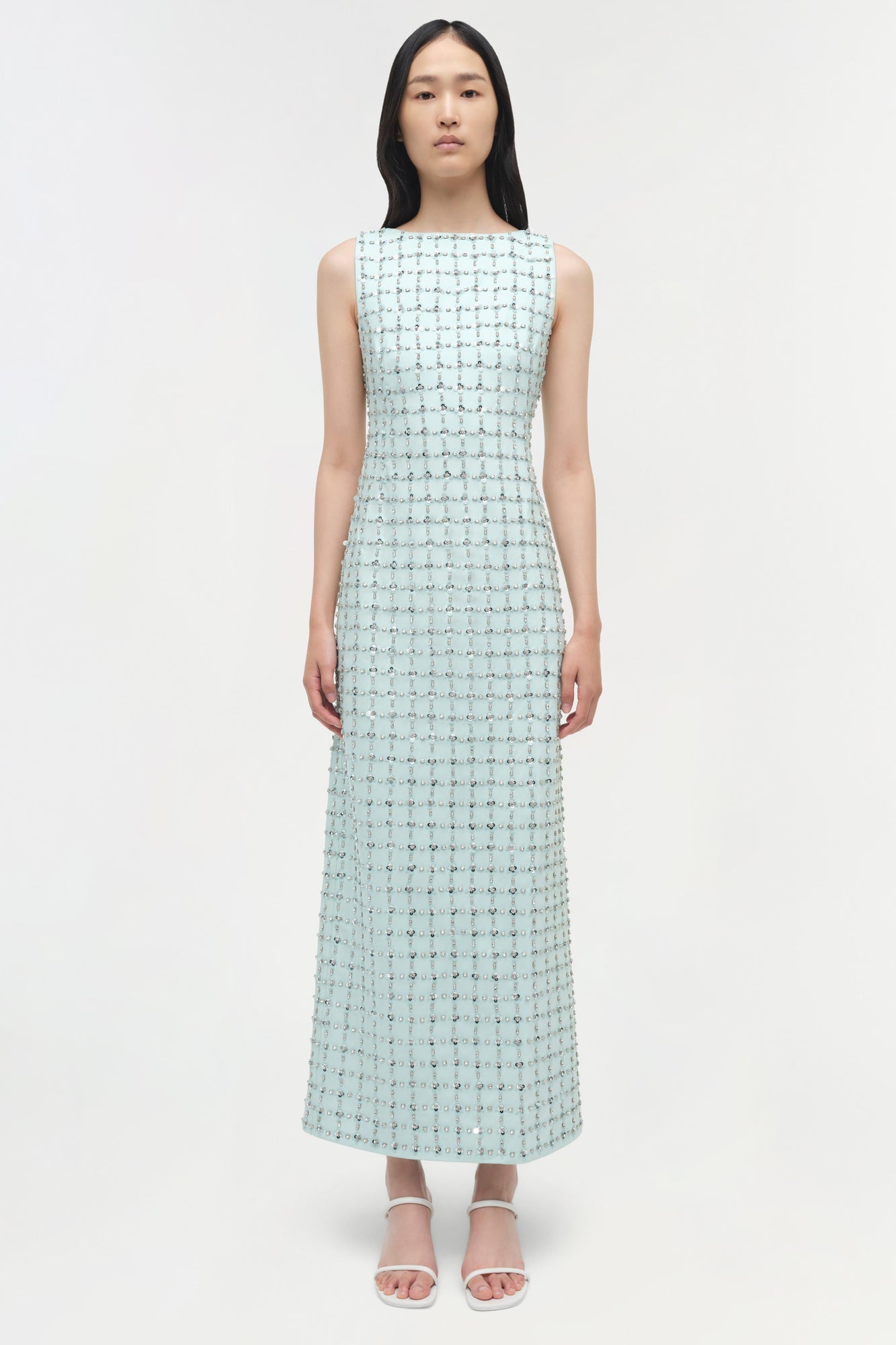 Light blue sleeveless midi dress with allover beaded embellishment and fitted silhouette.