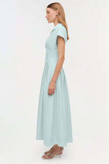 Light blue cotton faille midi dress with short sleeves and pleated skirt, shown on model from side view.
