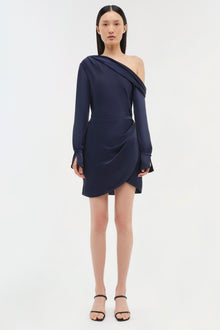 Navy blue one-shoulder dress with long sleeves and draped asymmetrical skirt detail.