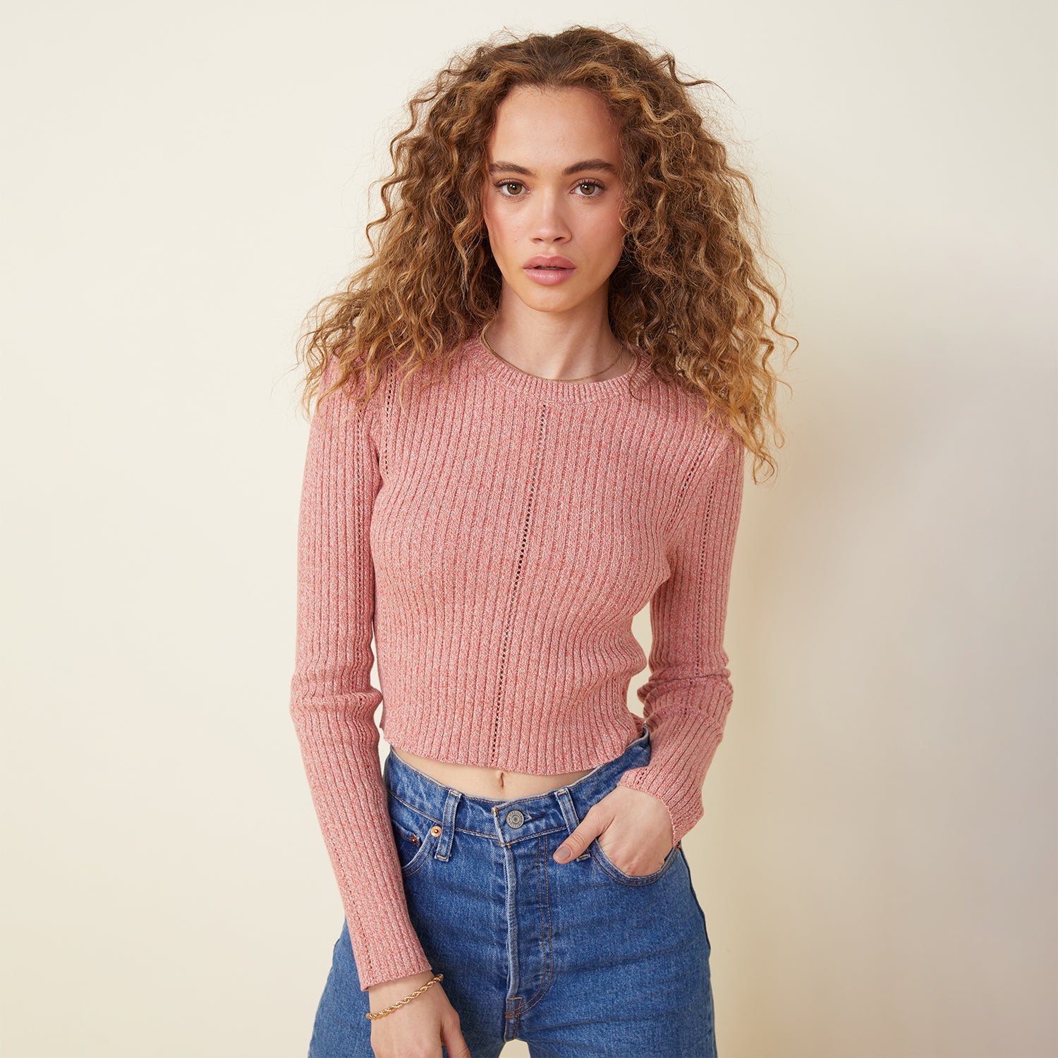 Front view of model wearing the marled sweater long sleeve top in nest.