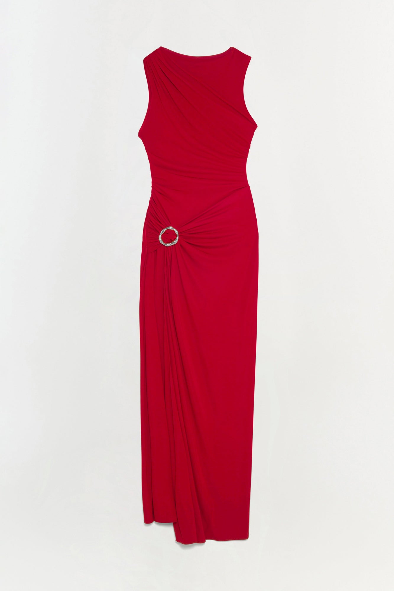 Red sleeveless jersey gown with ruched side detail and circular silver buckle accent at waist.