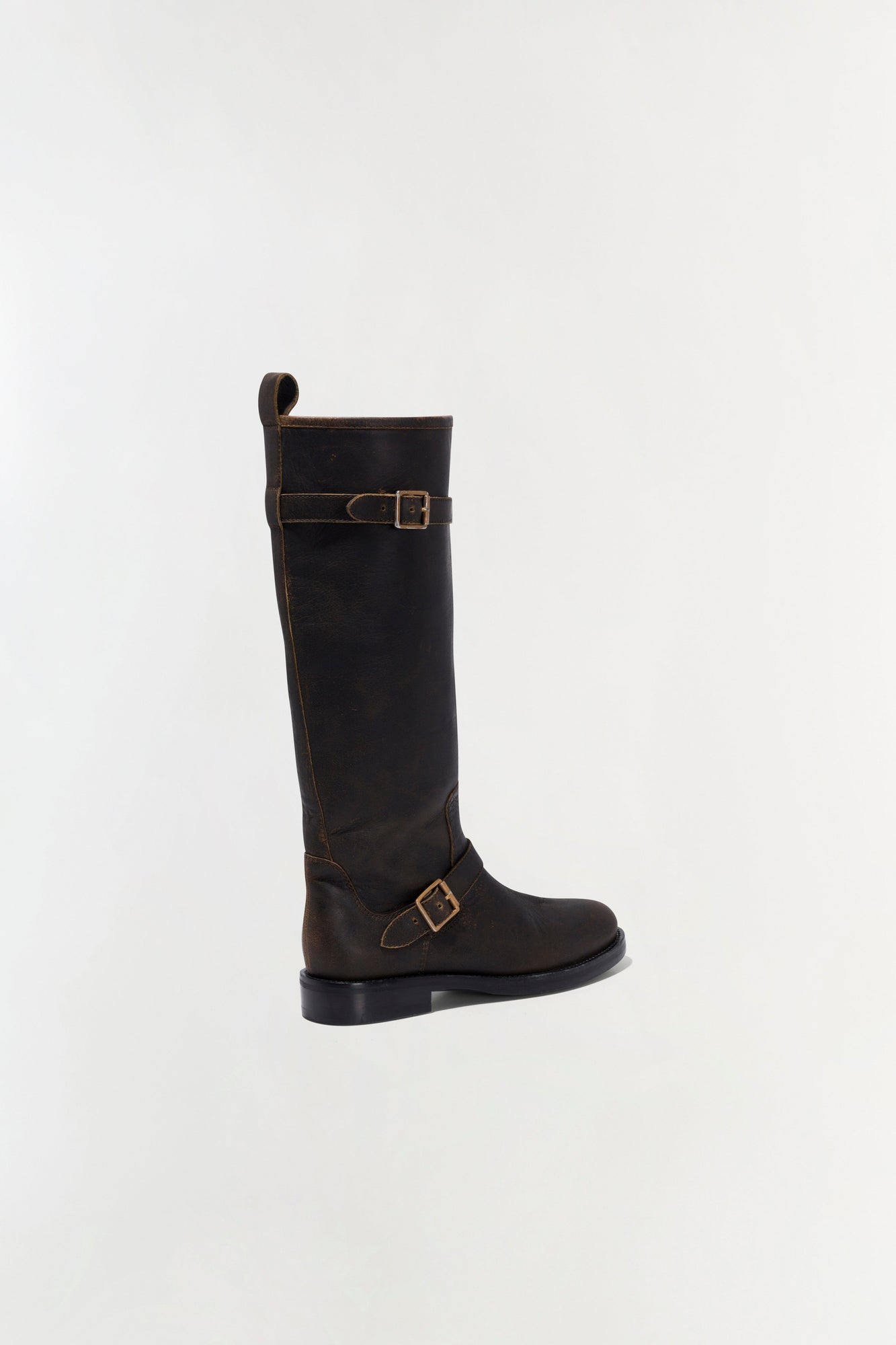 Black leather moto boot with buckle straps and flat sole, shown from the back angle.