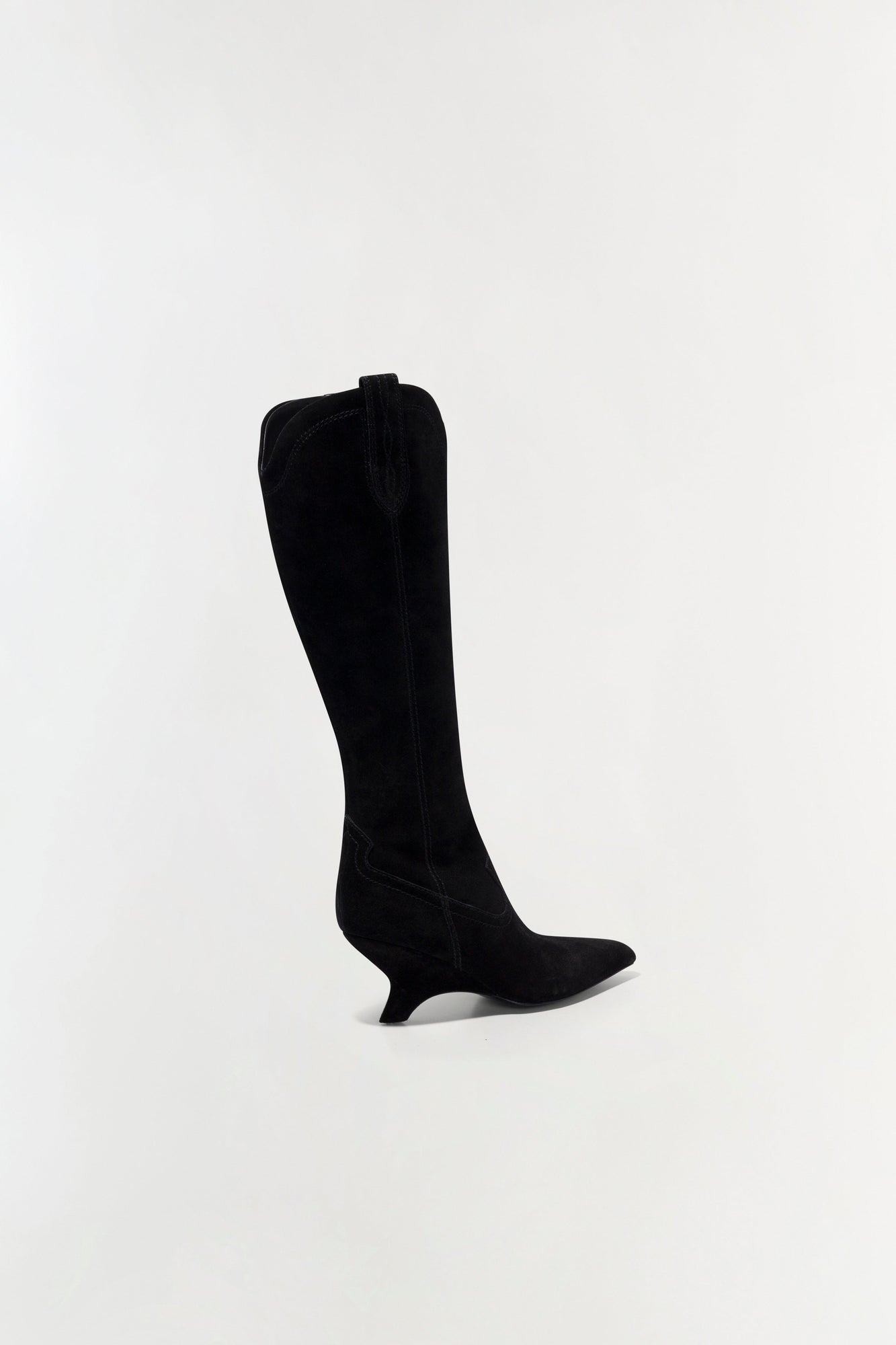 Black suede knee-high boot with a kitten heel and pointed toe, shown in side profile.
