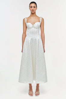 White jacquard midi dress with sweetheart neckline, beaded straps, and fitted bodice on model.