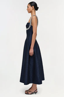 Navy jacquard midi dress with beaded neckline, sleeveless cut, and A-line skirt on model.