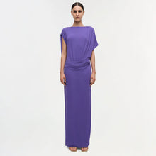 Purple draped gown with short sleeves and ruched waist detail extending to floor length.