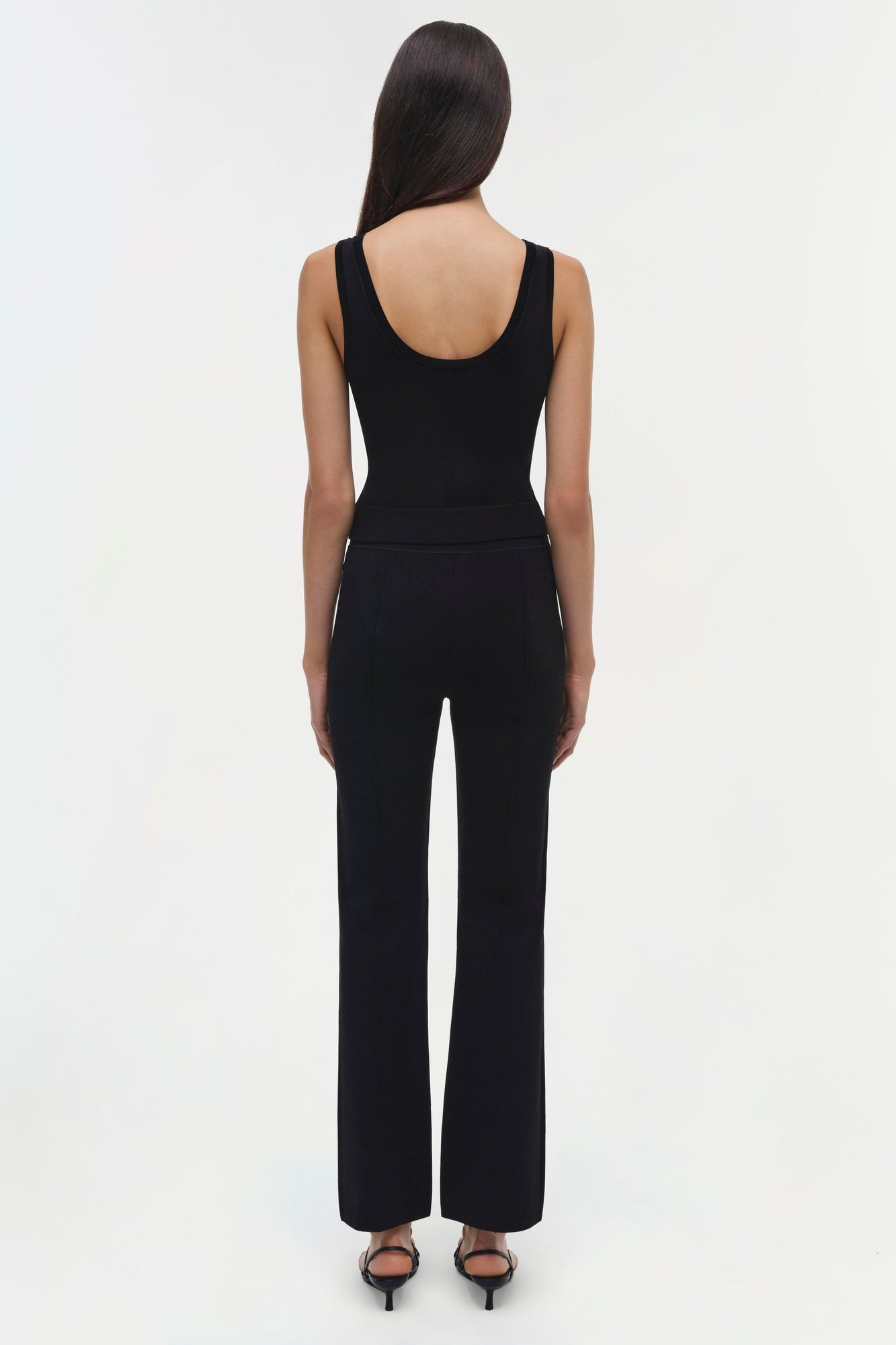 Black sleeveless tank top with matching high-waisted wide-leg pants, shown from back view on model.