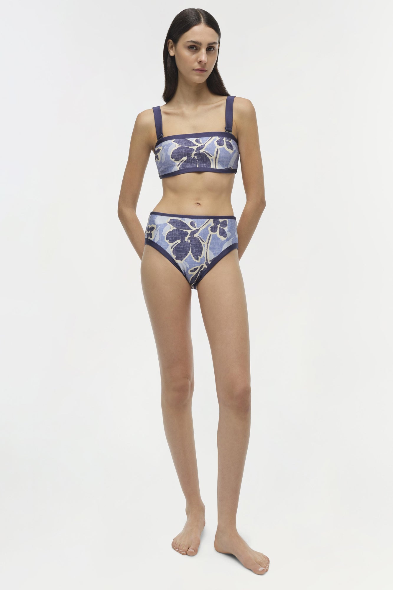 Blue and white floral print bikini top with square neckline and thin shoulder straps.