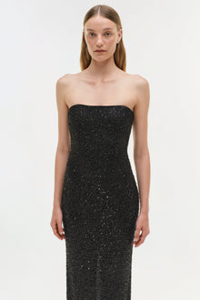 Black sequin strapless gown with fitted bodice and floor-length skirt.
