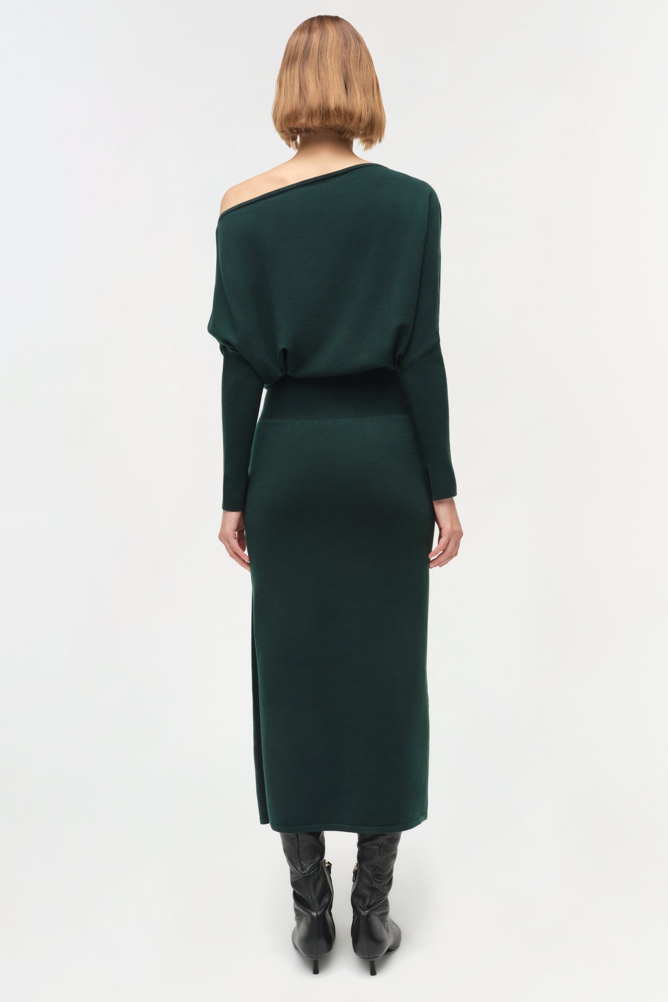 Dark green off-shoulder midi dress with long sleeves and fitted silhouette, shown from back view.