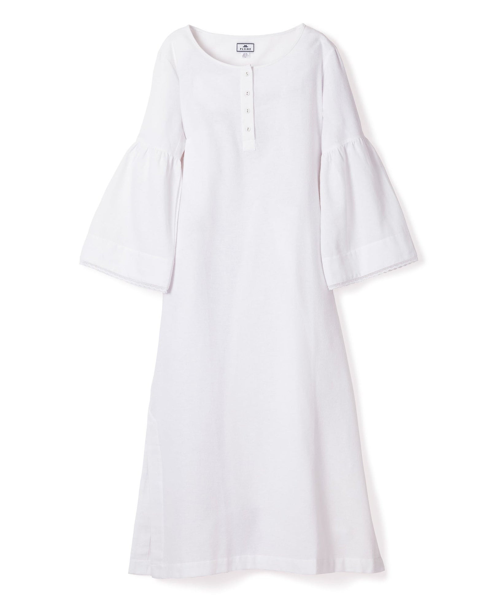The Womens Flannel Seraphine Nightgown in White by Petite Plume is a long-sleeved, buttoned-neckline dress with bell sleeves. Made from high-quality cotton, it combines simplicity and elegance with a loose fit and modest length.