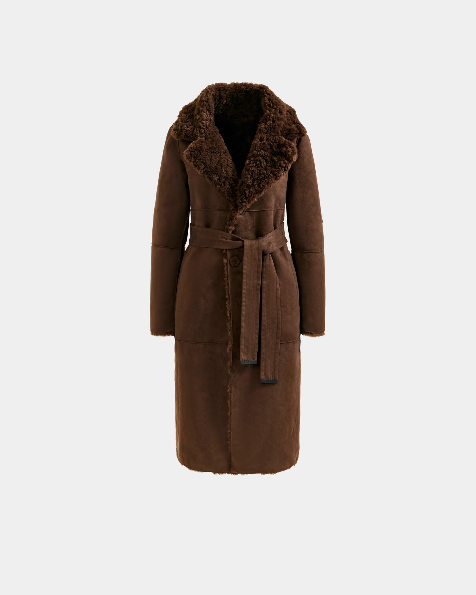 The ANNABELLE FSU - L125512 Espresso by Rudsak is a brown faux suede trench coat featuring a wide textured collar, matching waist belt, soft cozy lining, tailored fit, and below-the-knee length.