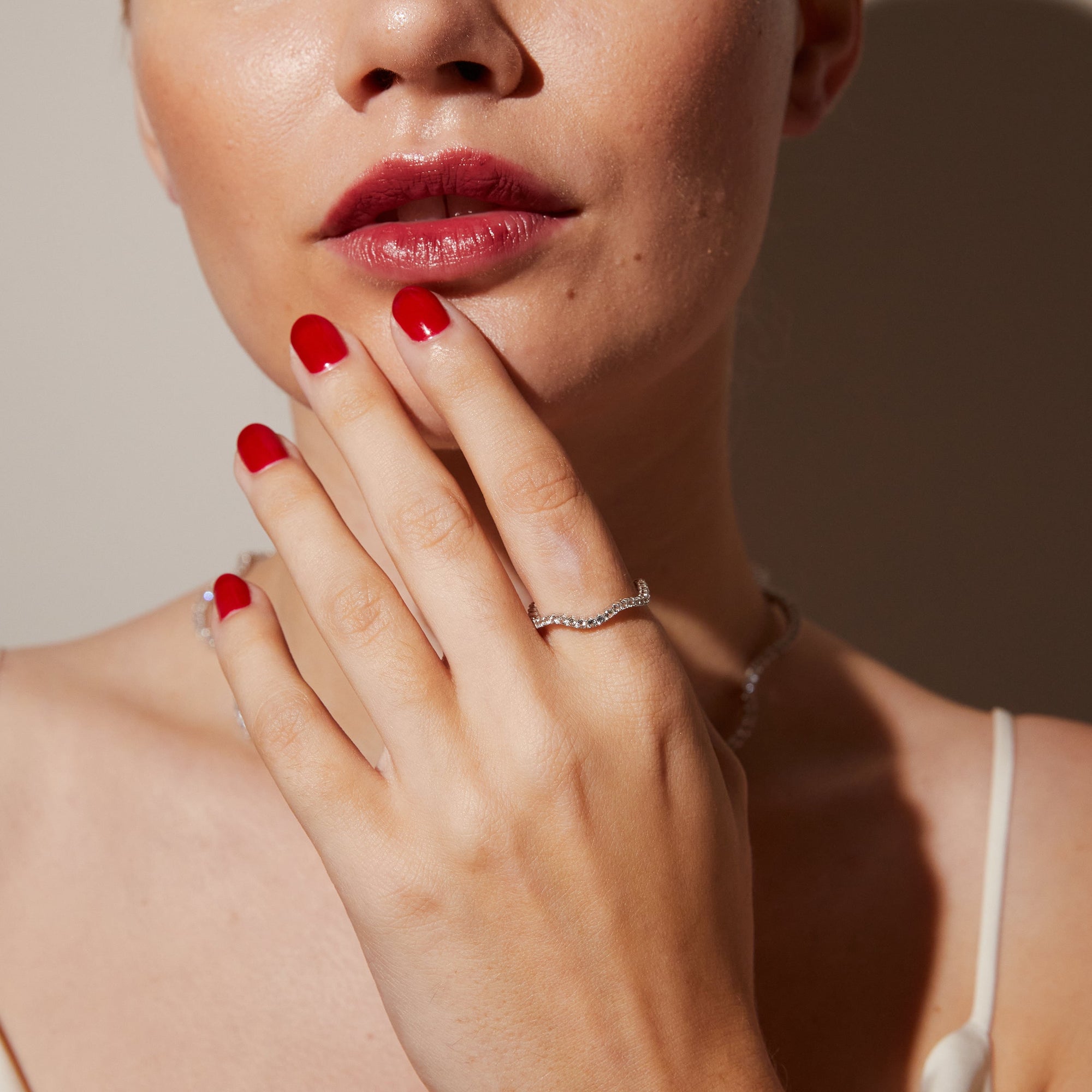 Model. Close up of woman wearing gemstone ring