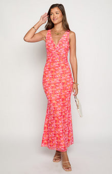Front view of an orange and pink floral print maxi dress with a V-neck and ruched bodice