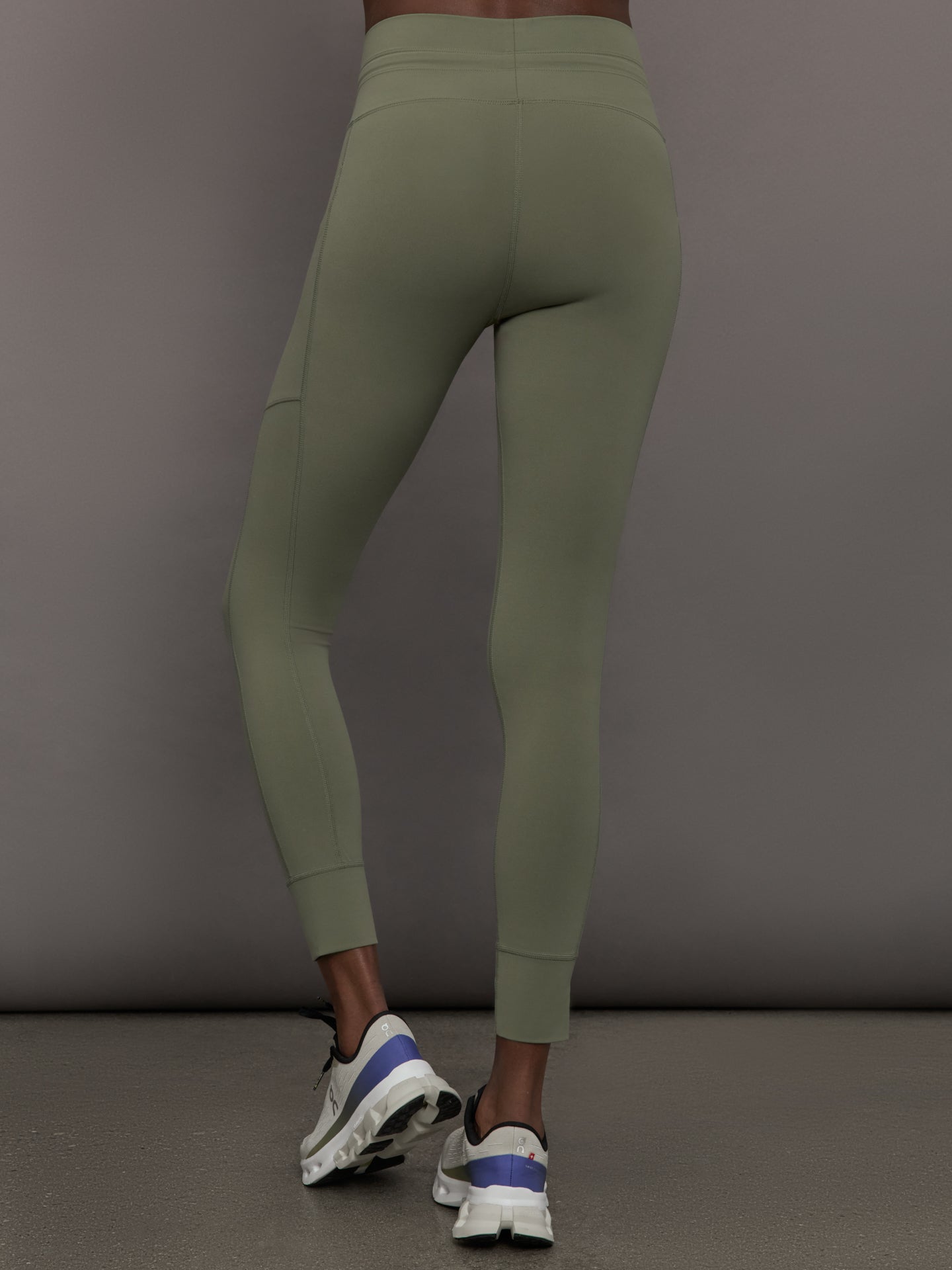 Back view of Melt High Rise Sport Pocket Legging in Moss on model.