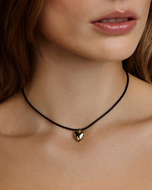 Small Puffy Heart Leather Cord Necklace gold necklace - close-up detail | fine necklaces