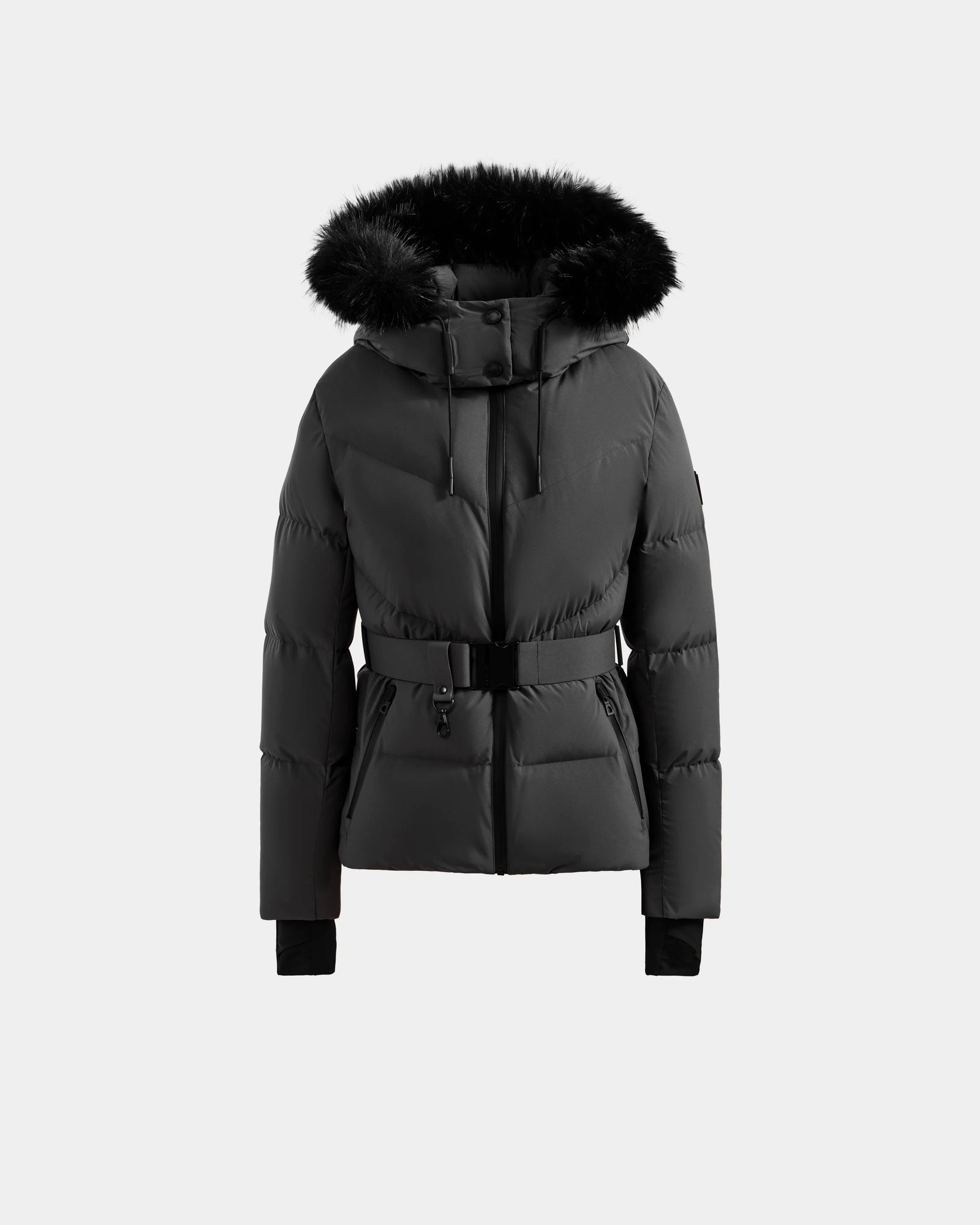 The CHRISTELLE M - L125542 Grey by Rudsak is a grey quilted down puffer jacket with a hood trimmed in black faux fur, front zipper, and matching waist belt, showcased against a plain light gray background.
