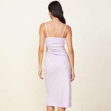 Back view of model wearing the linen slip dress in wisteria.