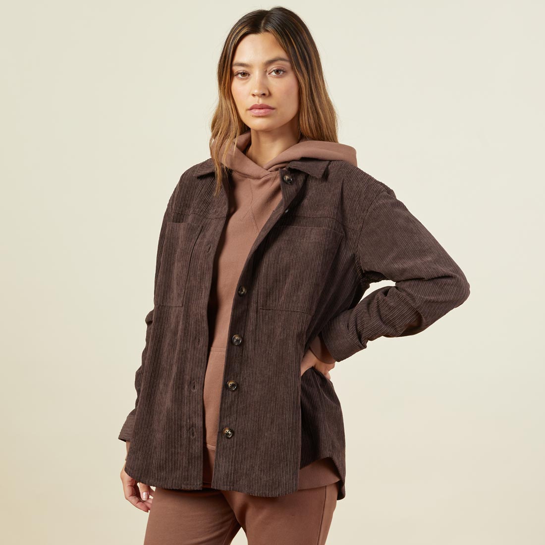 Side view of model wearing the corduroy shacket in dark oak.