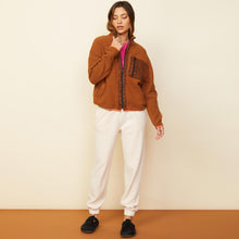 Front view of model wearing the leopard trim fleece jacket in caramel.