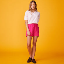 Front view of model wearing the polo sweater tee in bubble gum. 