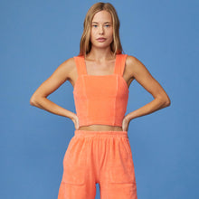 Front View of model wearing the Terry Cloth Cropped Tank in Georgia Peach