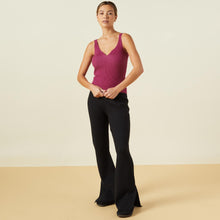 Front view of model wearing the sweater rib tank in raspberry rose.