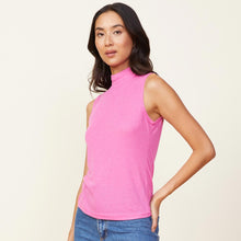 Side view of model wearing the light mock neck tank in raspberry rose.