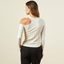 Back view of model wearing the flat rib asymmetric long sleeve in off white.