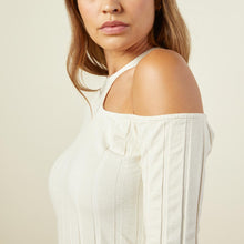 Close up view of model wearing the flat rib asymmetric long sleeve in off white.