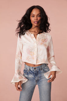 Floral top with long bell sleeves and our custom LoveShackFancy buttons down center front.