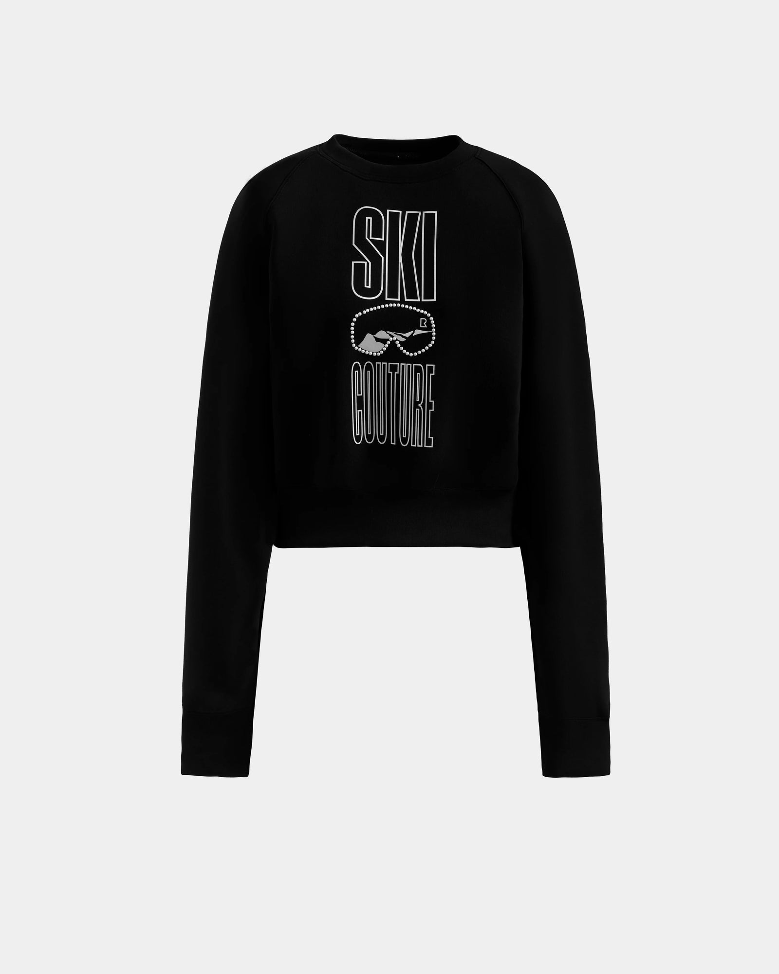 The Rudsak LIDDIE - L525505 Black is a cropped crewneck sweater with SKI COUTURE and ski goggles graphic in white, perfect for women's après-ski style and winter vibes.