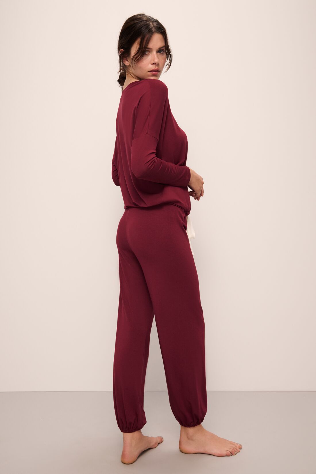 Model wears Gisele TENCEL Modal Slouchy PJ Set in Cabernet/Ivory.