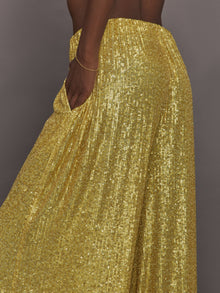 Model wears the Boyfriend Elephant Sweatpants in Asparagus, featuring a relaxed, tapered fit with oversized legs and sparkles.