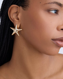 Puffy Star Earrings earring - close-up detail | gold earrings for women
