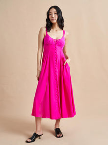 Named after supermodel and La Ligne muse, Paulina Porizkova, this gorgeous dress with sheer georgette straps and v-neckline features curve-defining shirring and smocked back panels for ease in bright fuchsia.