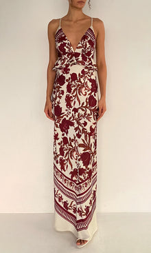Rococo Sand | Maia Polyester Satin Lycra Cross-Back Peplum Maxi Dress | Ivory Burgundy