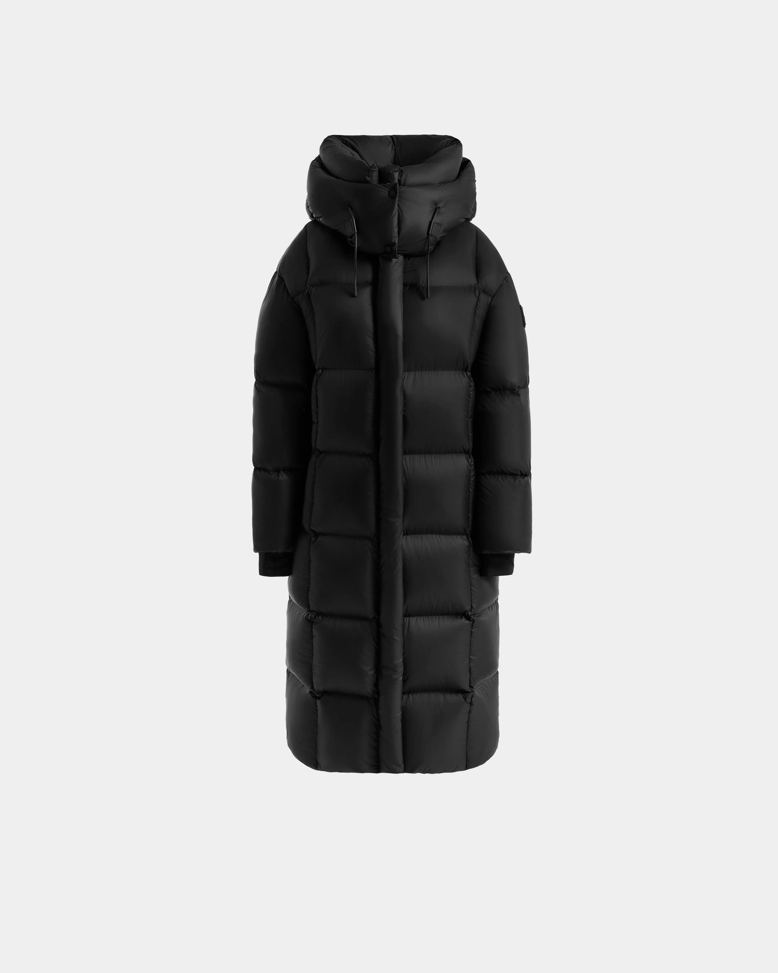 The Rudsak SASHA - 8125686 Black women's long down puffer coat features a high neck, removable hood, horizontal quilting, and front zip closure, shown against a plain light gray background.