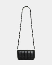 The Rudsak CHARLI X - 8324009 Black is a stylish black quilted leather bag with a rectangular design and long chain strap, shown on a white background. This chic convertible crossbody offers elegance and versatility for any occasion.
