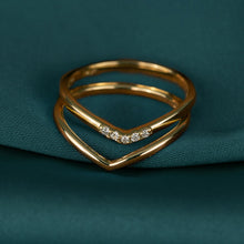 Flatlay Model. A close-up flatlay shot of two stacked gold rings.