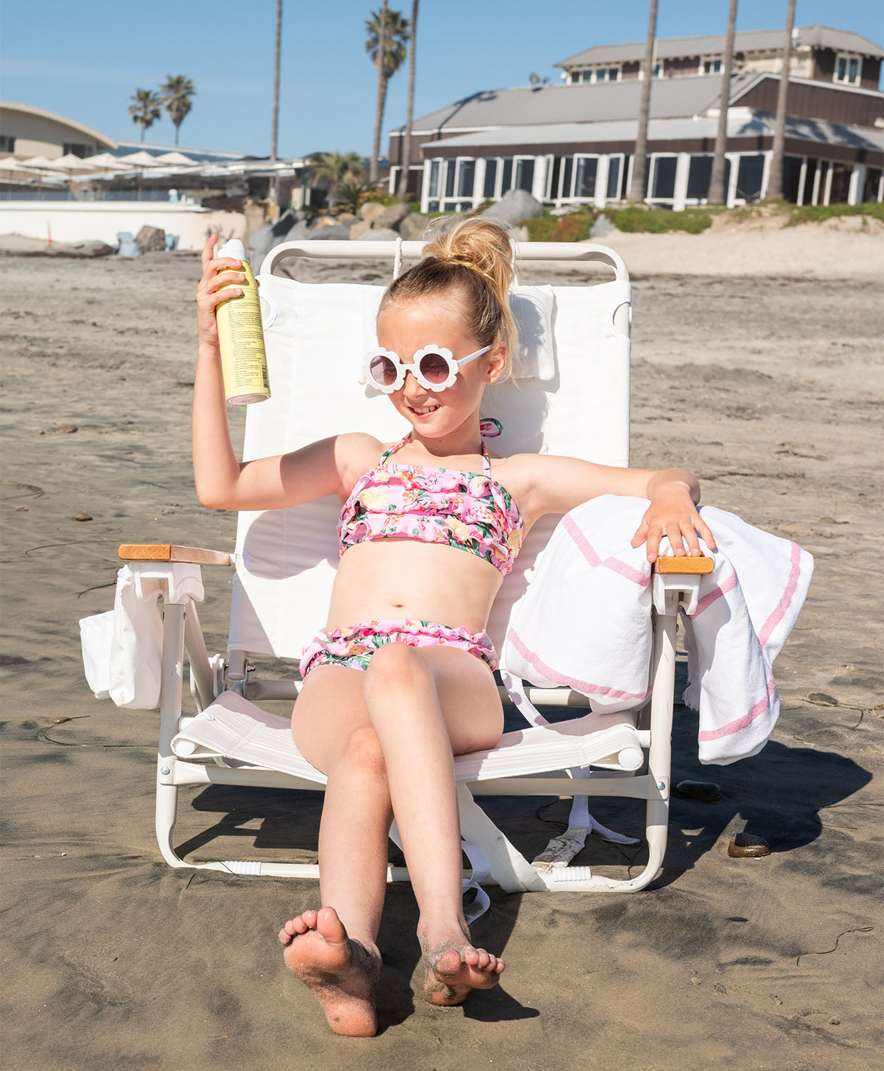 Kids Dahlia Ruffle Bikini — pink floral two-piece swimsuit with bold ruffles and adjustable neck ties.