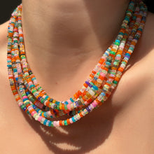Desert disco multi colored opal necklaces layered on the neck.