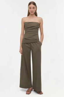 Olive green strapless cotton top with ruched detailing at the torso, paired with wide-leg matching pants.