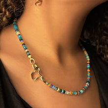 14k gold ripple charm attached in the clasp of our Jaipur Jazz Faceted Opal Necklace attached with a round charm lock.